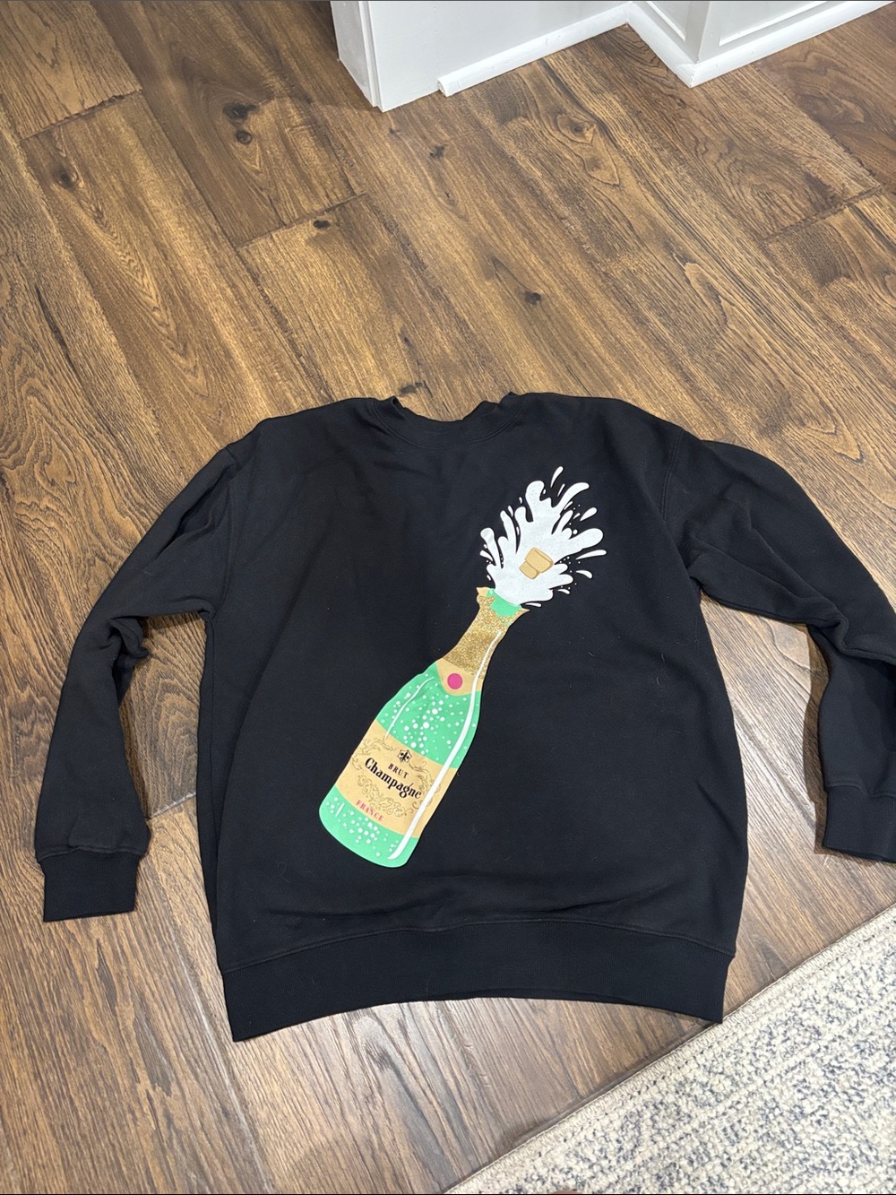 Black Sweatshirt with Sparkling Champagne Bottle Graphic
